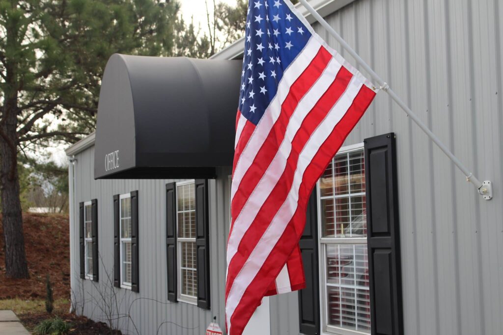 Powers and Gregory HVAC office exterior with american flag